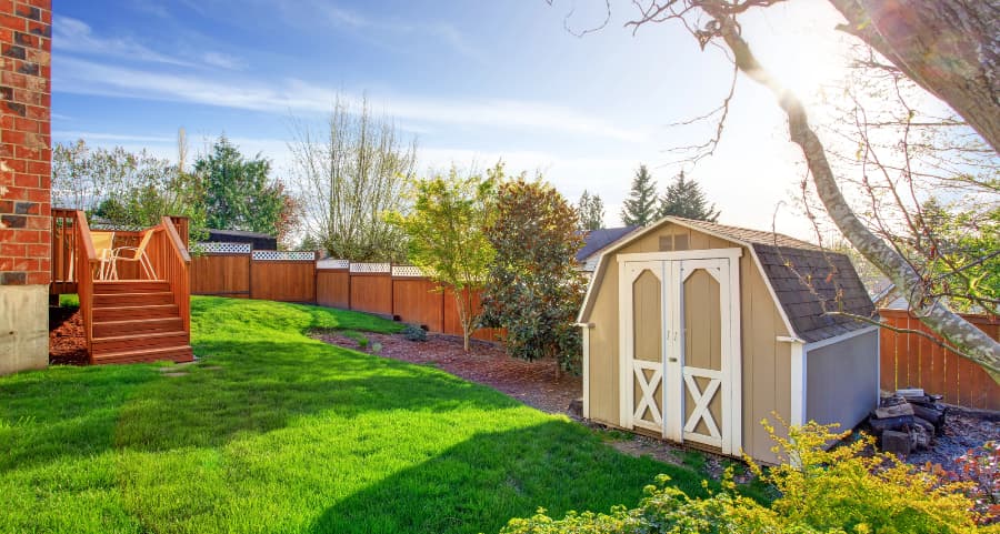 Fenced backyard with storage shed in Milwaukee